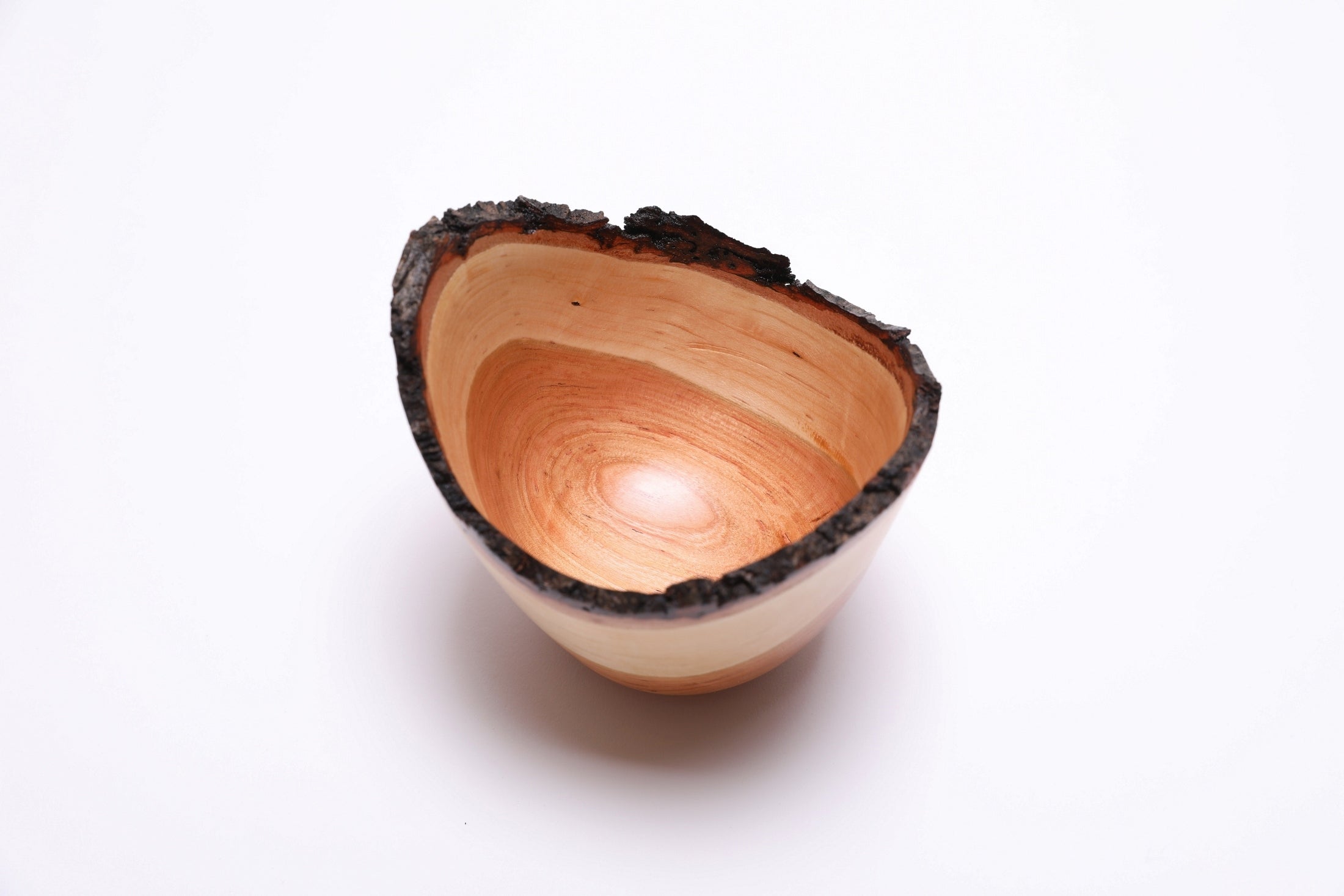 Natural edge cherry bowl with bark intact – angle view