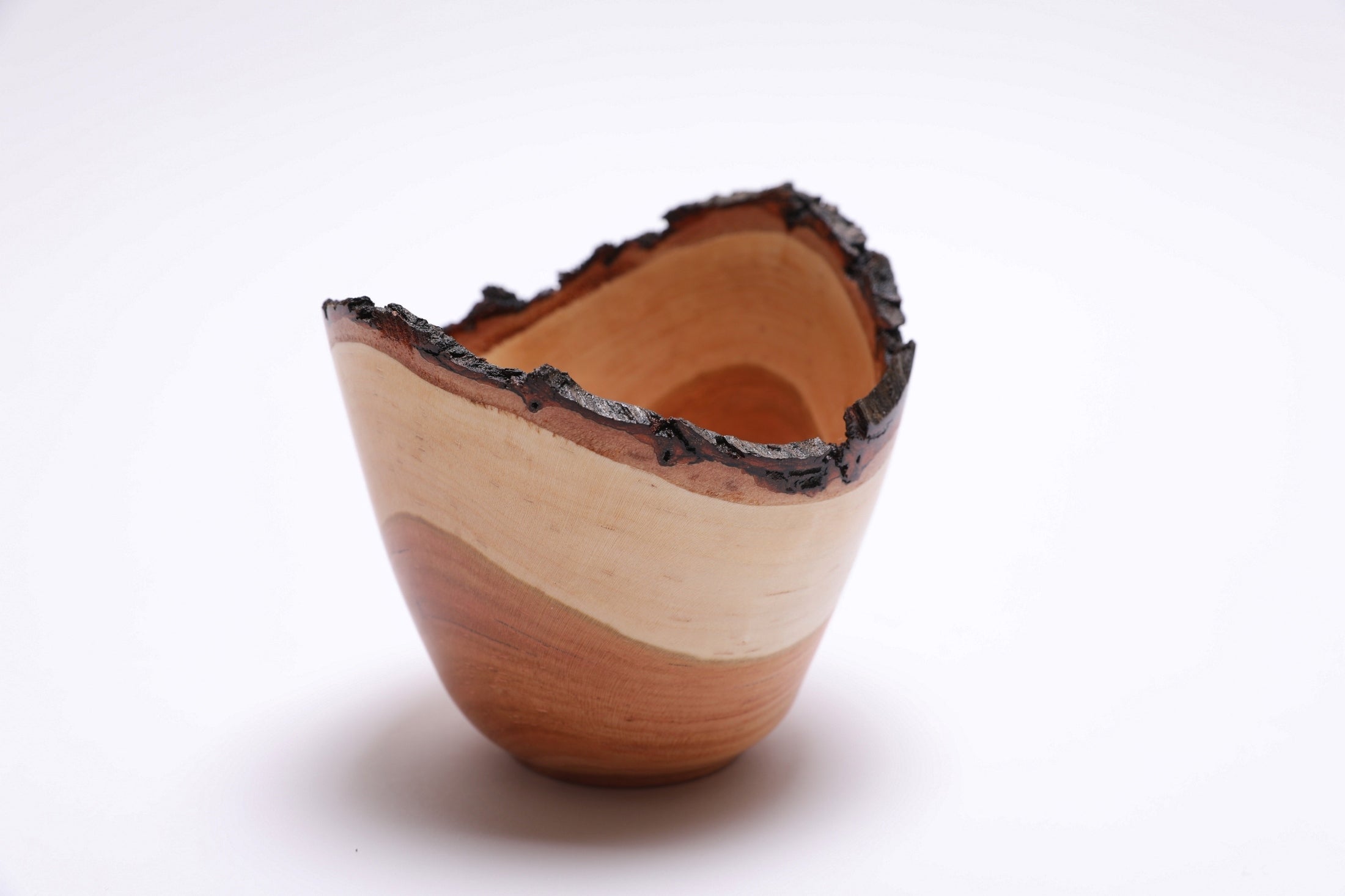 Handmade black cherry live edge bowl showing cream sapwood and copper heartwood
