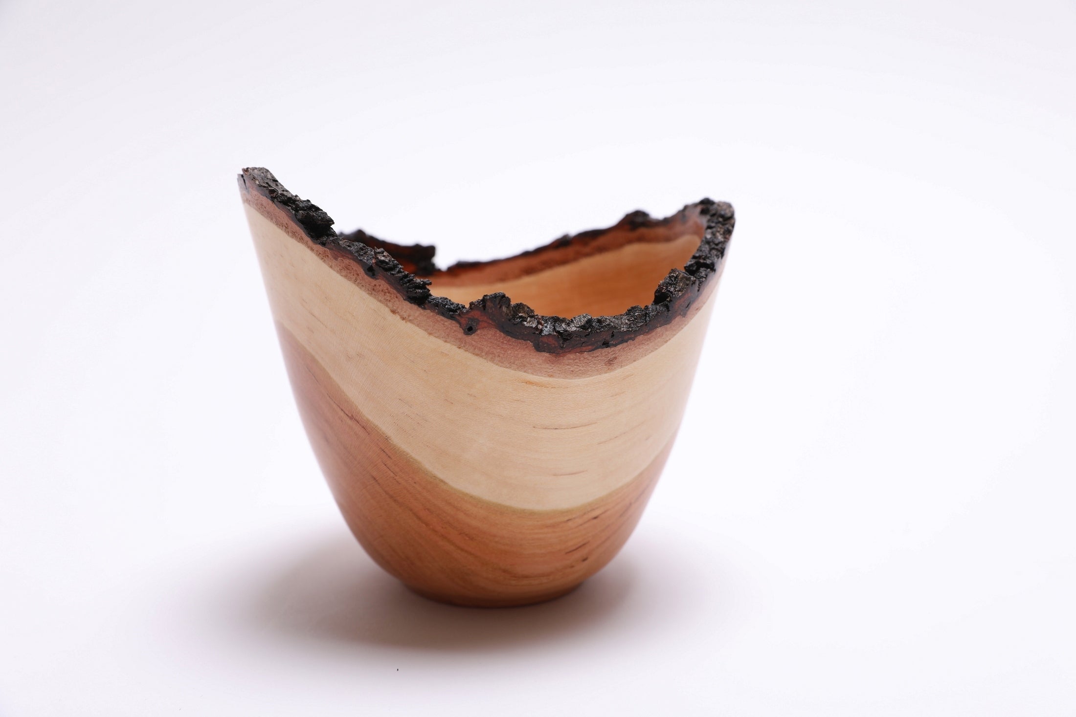 Natural edge cherry bowl showing wood grain detail