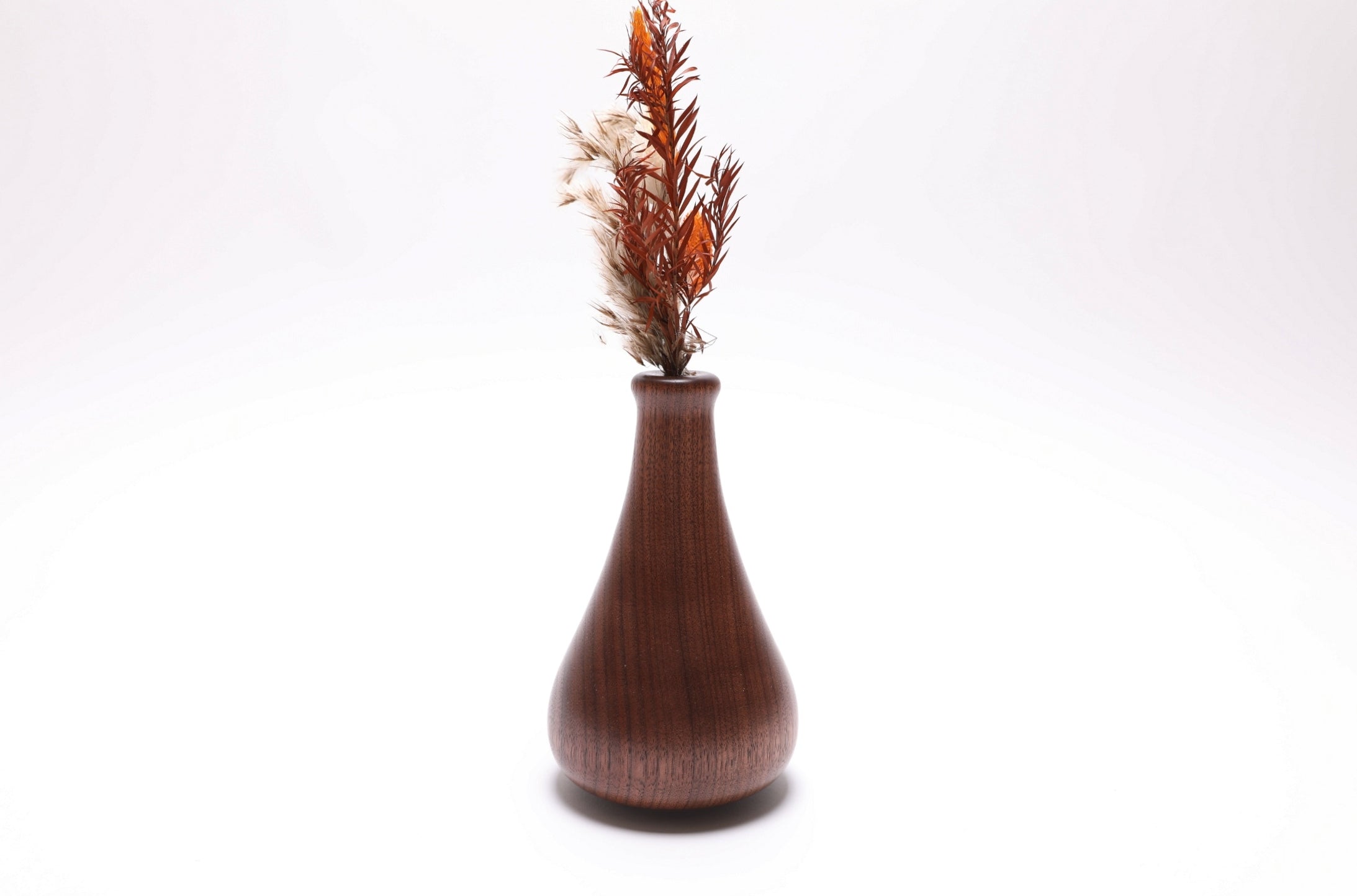 Handcrafted walnut dry vase with food-safe oil finish, side view
