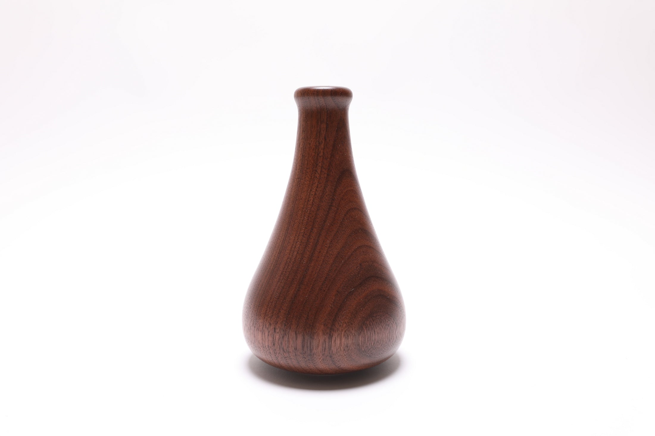 Elegant quartersawn walnut dry vase, close-up of grain and coloration