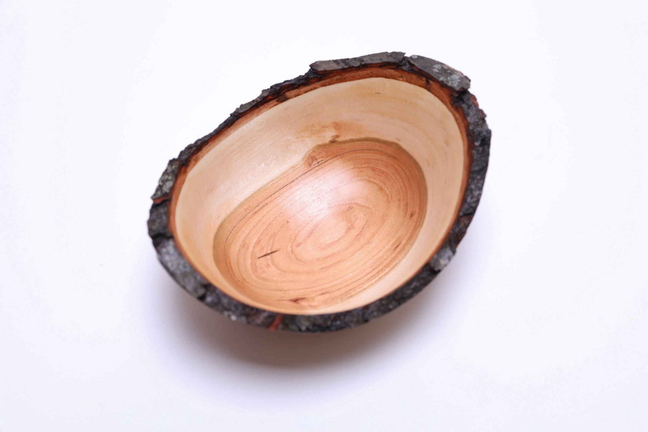 Wild black cherry bowl with food-safe oil finish, close-up of bark edge