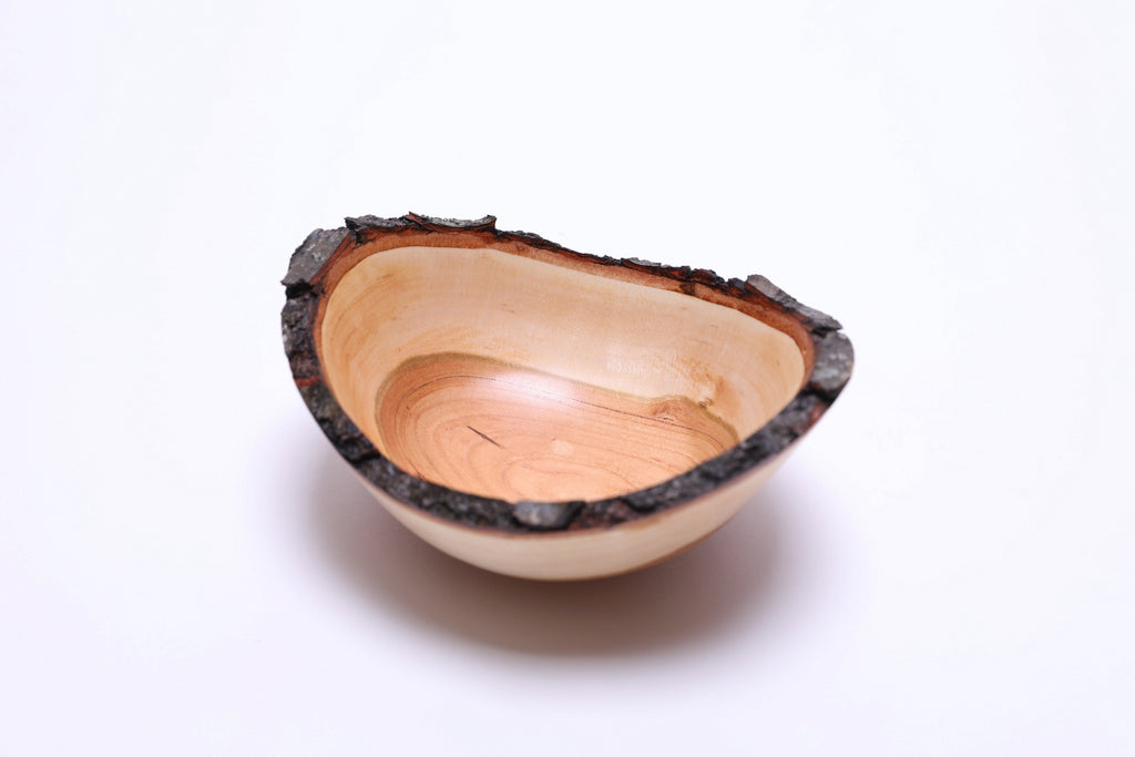 Natural edge black cherry bowl, softball-sized, neutral background