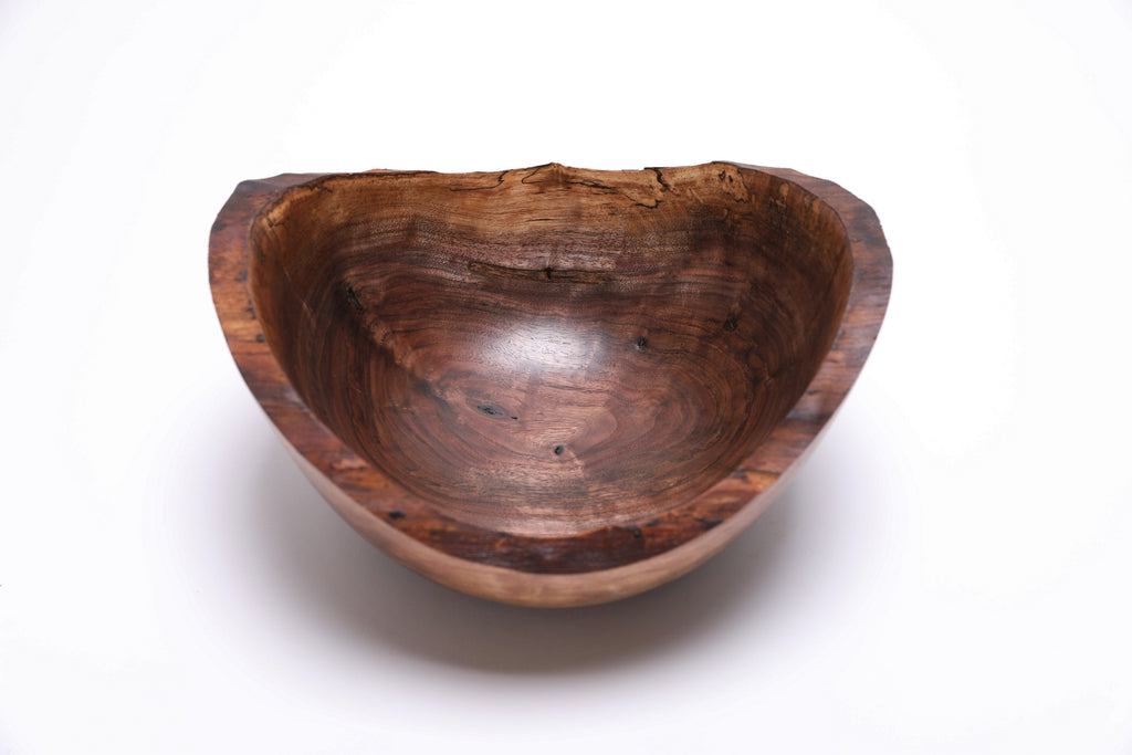 Black walnut burl bowl interior — chocolate, amber, and tan grain tones with spalting detail
