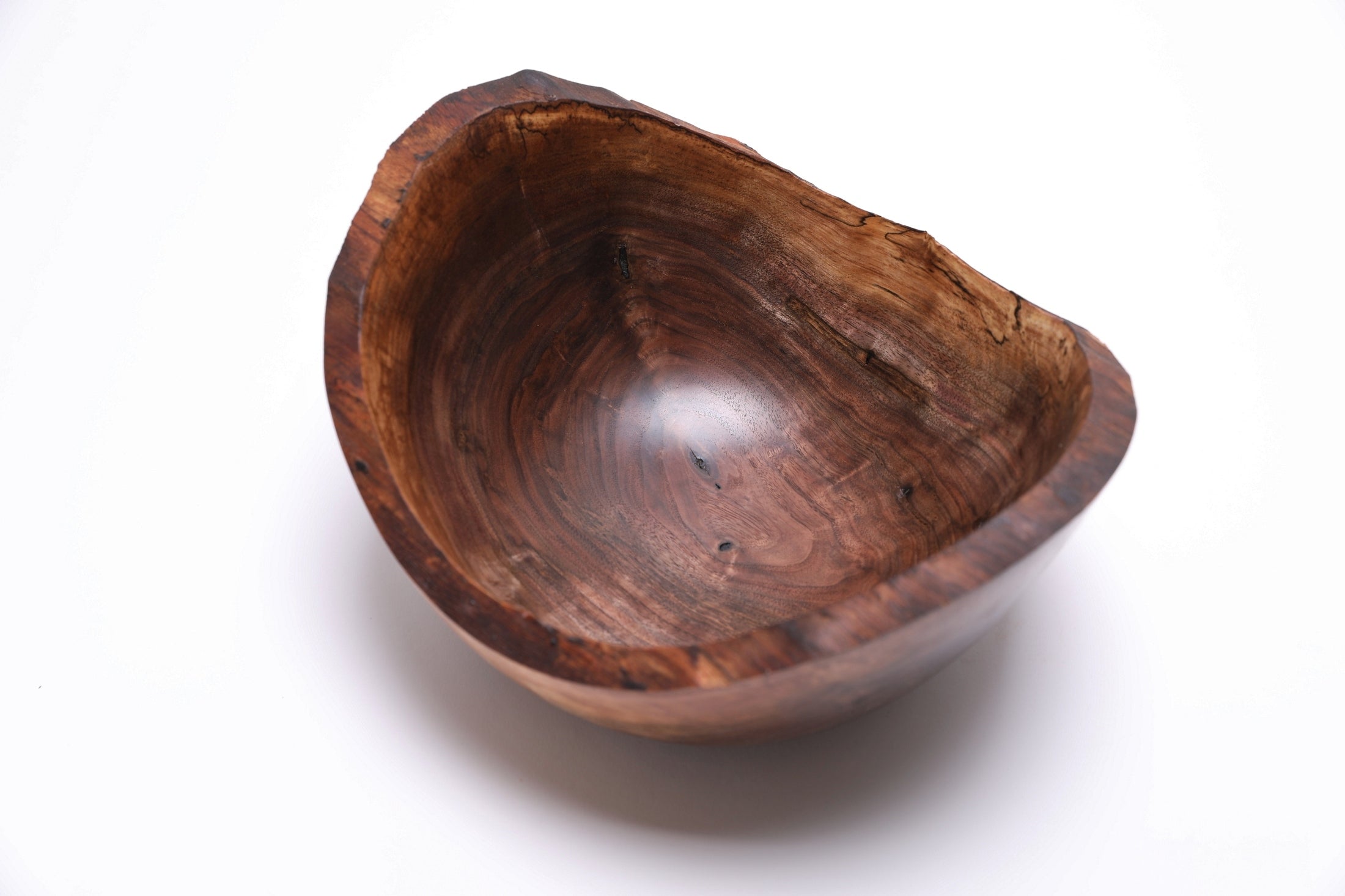 Natural edge walnut bowl — overhead shot showing full rim and spalting pattern