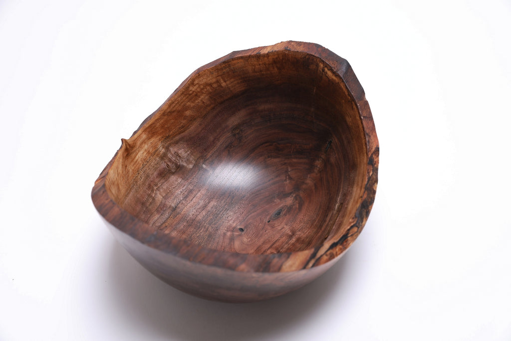 Handcrafted black walnut crotch burl bowl — three-quarter view highlighting chatoyant quilt figure