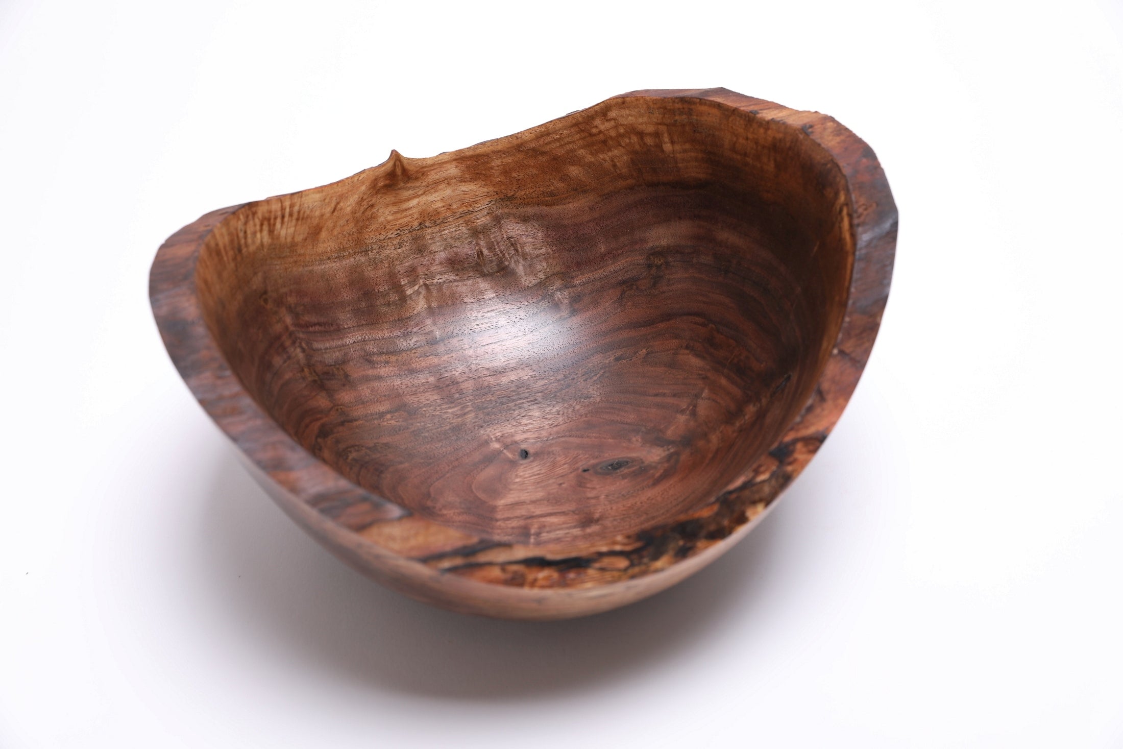 Wild black walnut crotch burl bowl — close-up of chatoyant figure and color variation