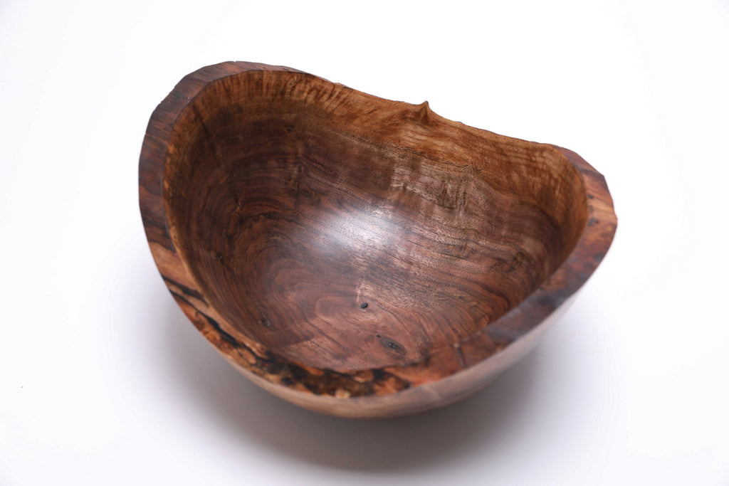 Handmade black walnut bowl — angled view showing bud scars and repaired stress cracks