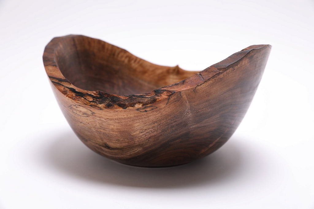Spalted wild black walnut natural edge bowl — side view showing spalting