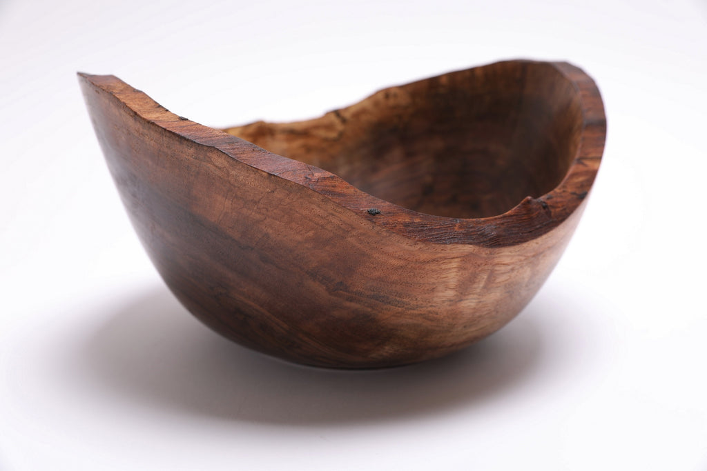 Natural edge spalted walnut bowl — side profile showing depth and live edge