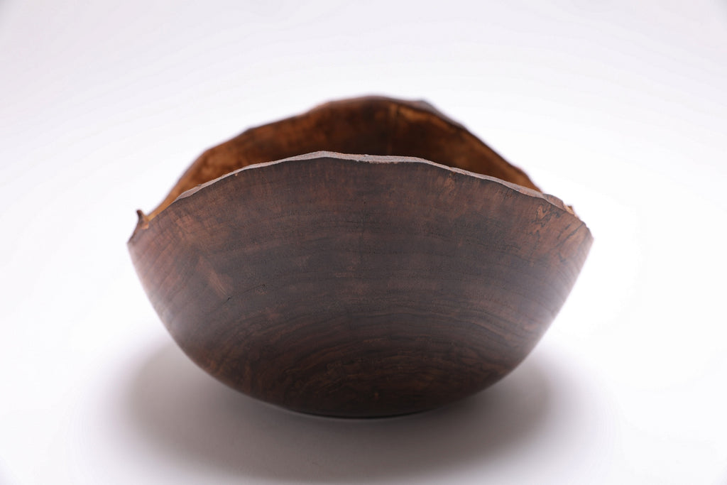 Black walnut natural edge bowl — detail of grain, figure, and oil finish sheen