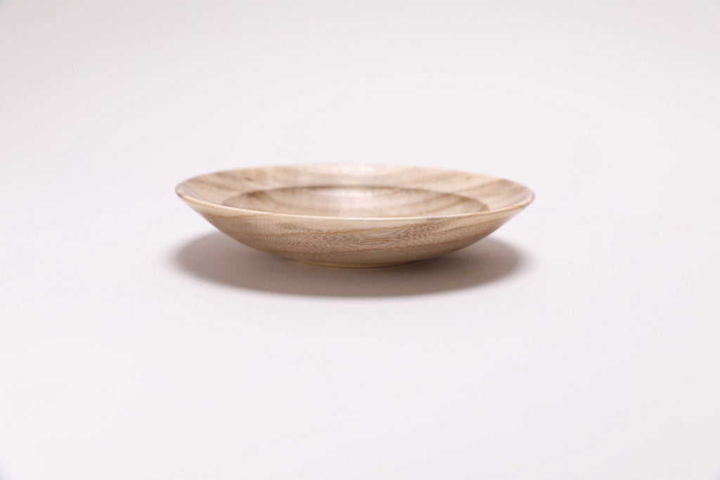 Iridescent hackberry ring dish — side view of figure and color variation in natural light