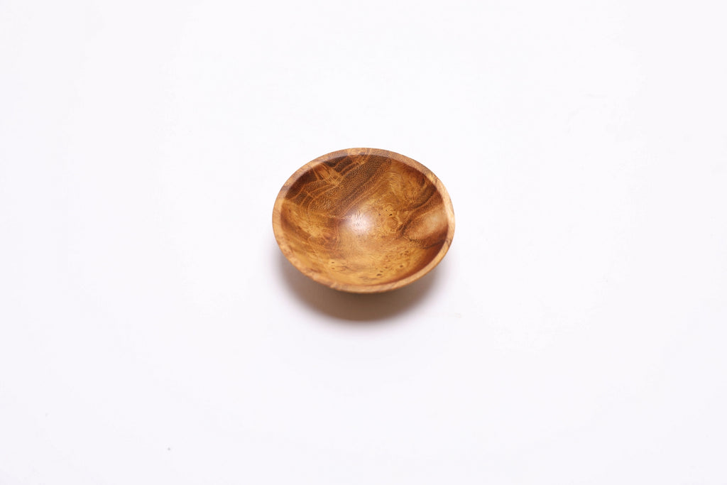 Tiny mulberry burl bowl showing natural burl figure and grain detail