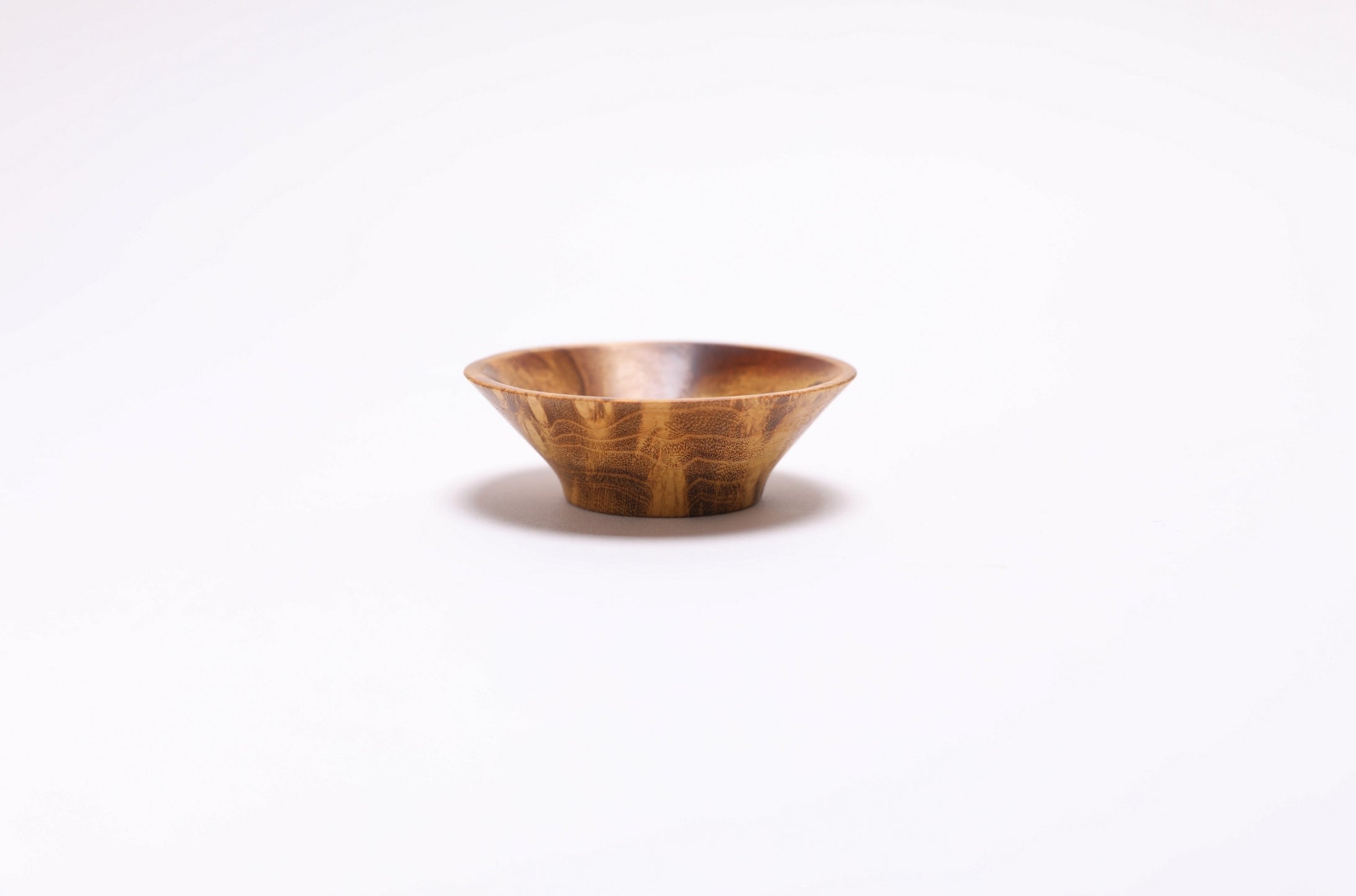 Close-up of mulberry burl figure on hand-turned wooden bowl