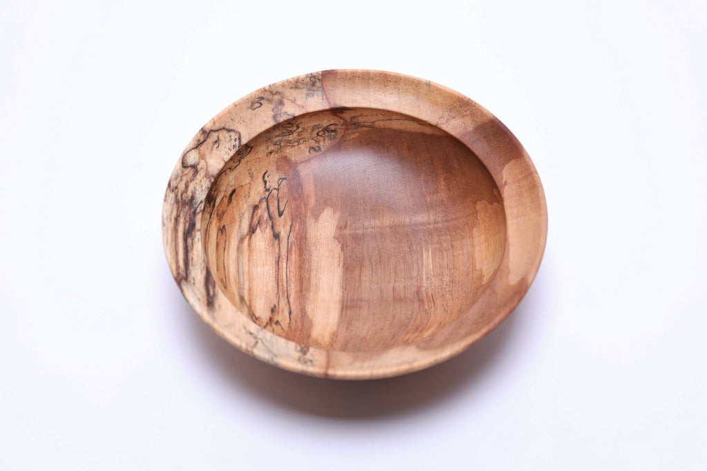 Spalted river birch wooden bowl, top view at 270°, cream and bronze wood tones with natural ink-black spalting, handmade in USA