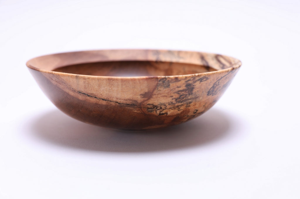 Spalted river birch wooden bowl, side view at 90°, showing ink-black spalting lines and undercut rim, Sanders Woodworking