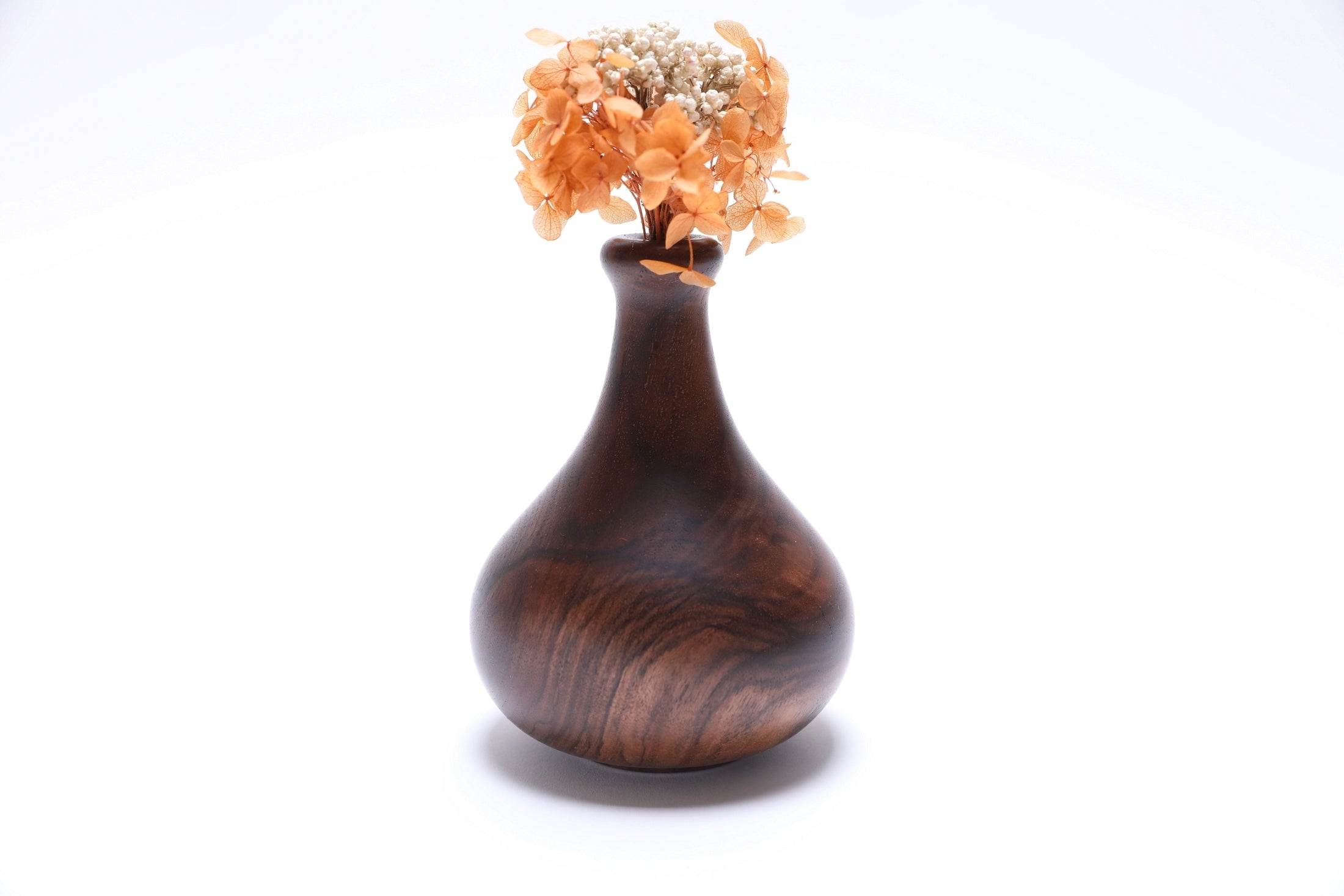 Claro walnut burl weed pot with dried flowers, side view rotated 180 degrees, food-safe oil finish