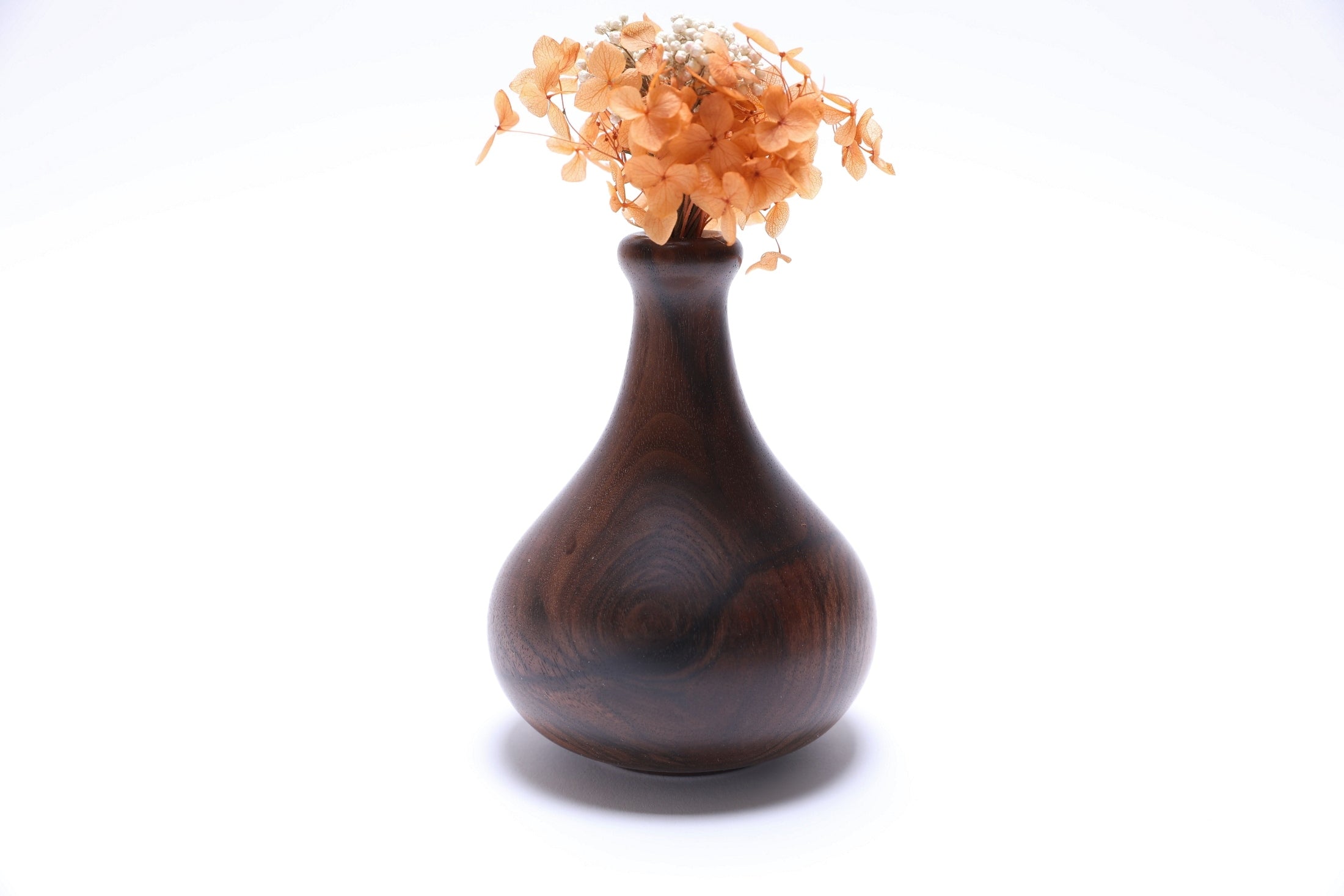 Claro walnut burl weed pot with dried flowers, side view rotated 270 degrees, artisan handcrafted hardwood