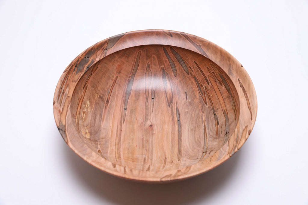 Top view of ambrosia maple salad bowl rotated 90 degrees, natural ambrosia figure detail