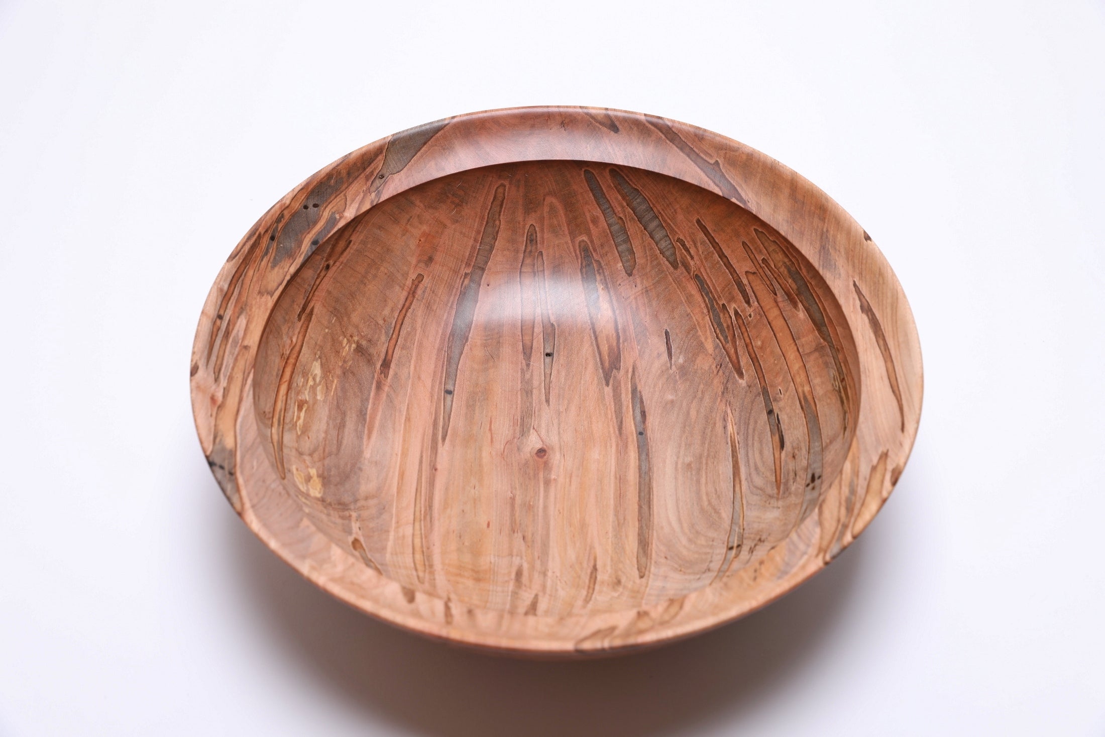 Top view of ambrosia maple salad bowl rotated 90 degrees, natural ambrosia figure detail
