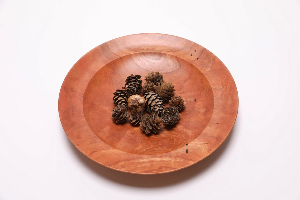 Wild black cherry shallow bowl #2789 with pine cones, top view showing scale and natural coloration