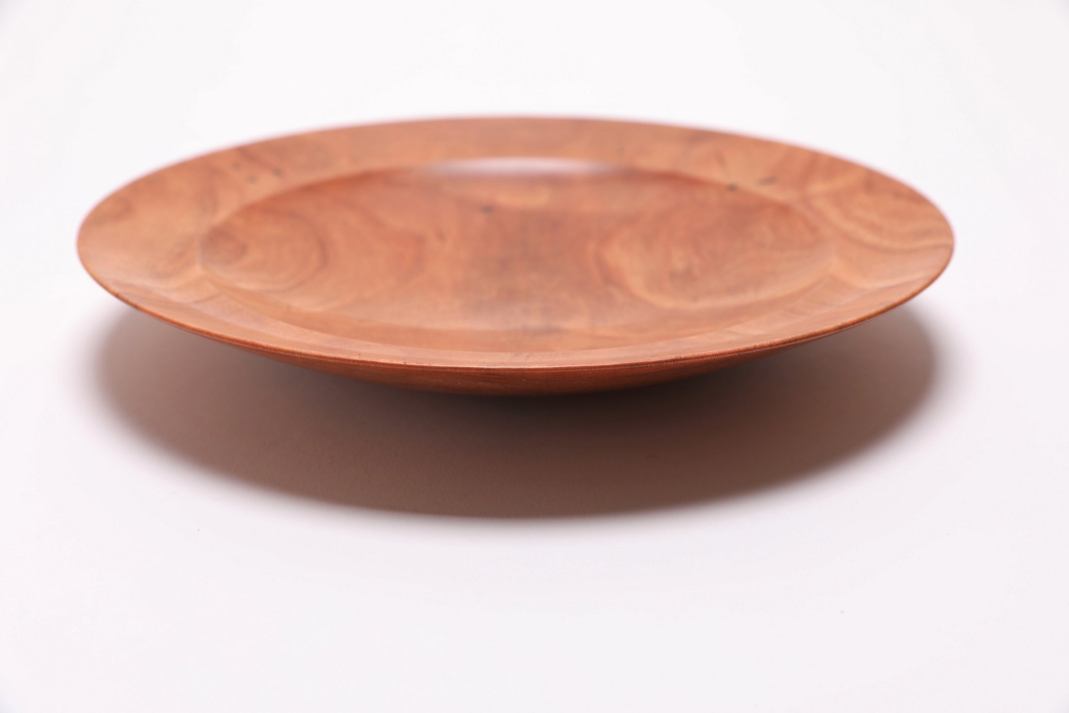 Handcrafted wild black cherry bowl #2789, angled view showing curved taper rim and raised foot, Sanders Woodworking