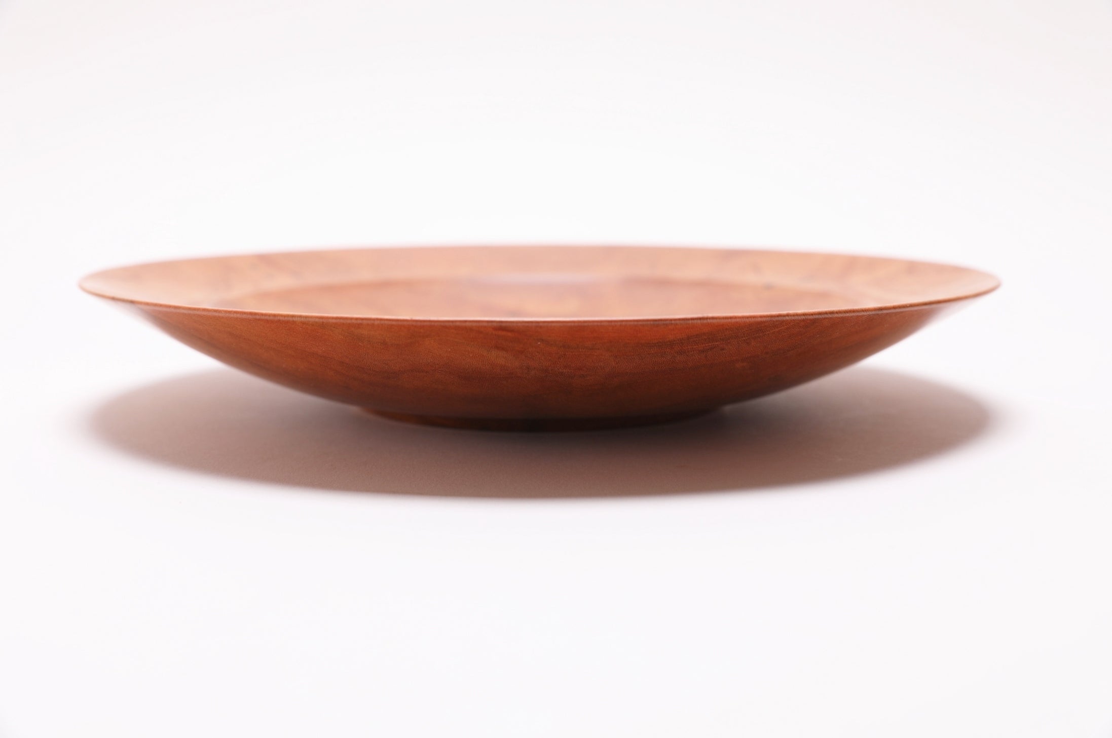 Wild black cherry shallow bowl #2789, side view showing 9 5/8 inch diameter and 1 1/2 inch depth