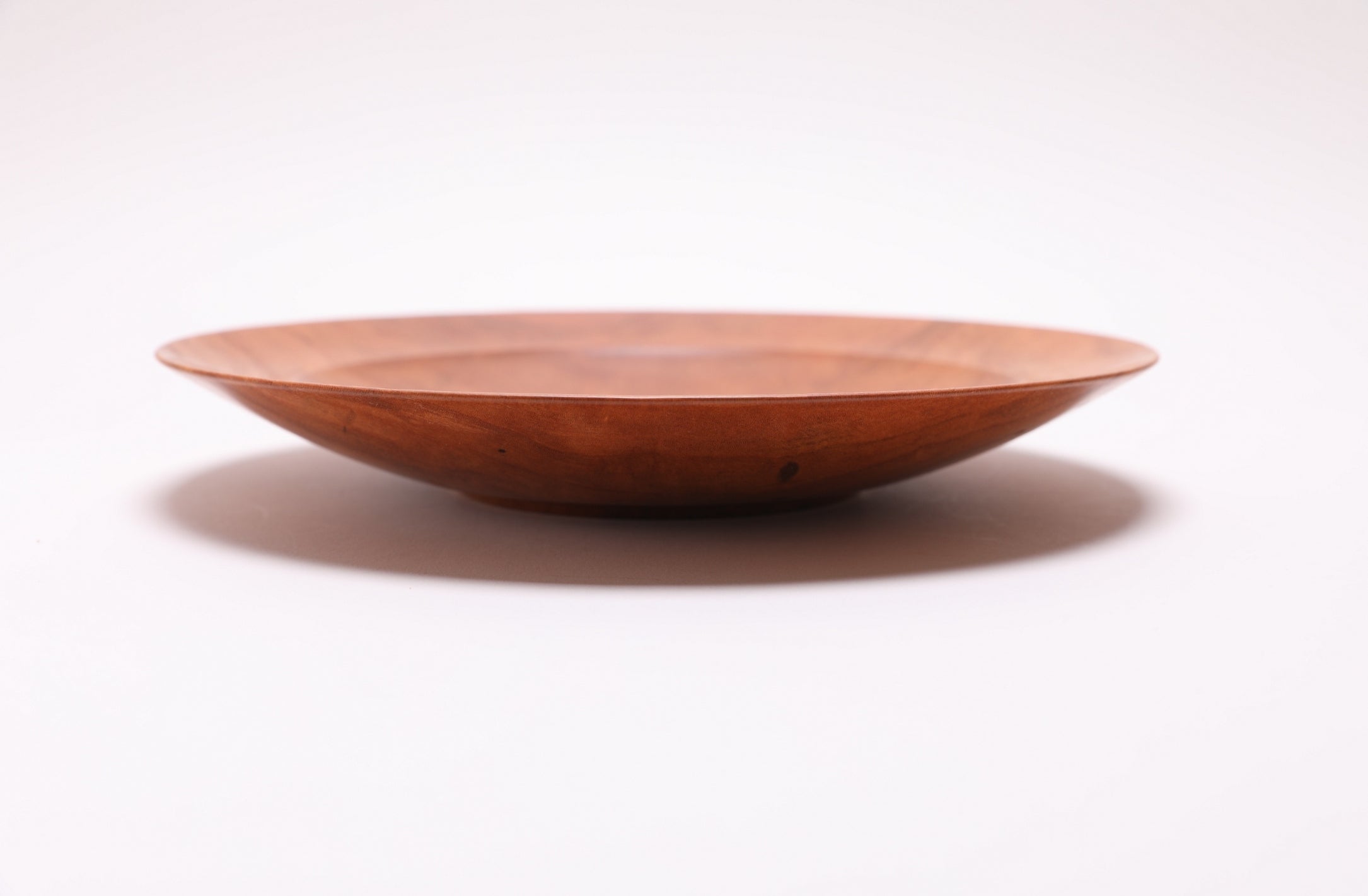 Wild black cherry shallow bowl #2789, side view rotated 180 degrees, deep pink and orange grain, handmade in NC