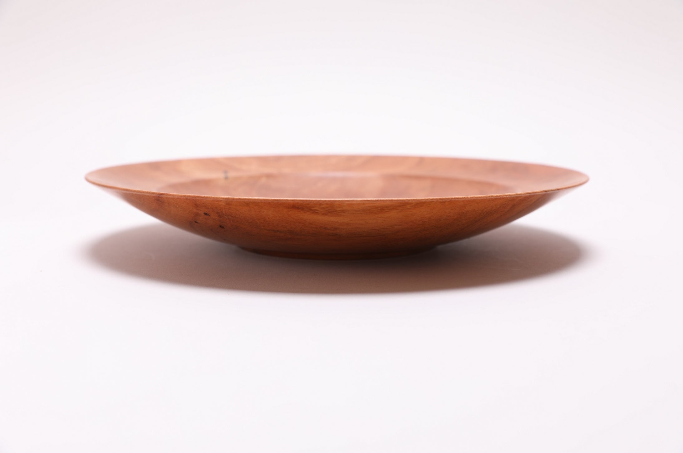 Handcrafted wild black cherry bowl, side view rotated 270 degrees, raised foot detail, Sanders Woodworking