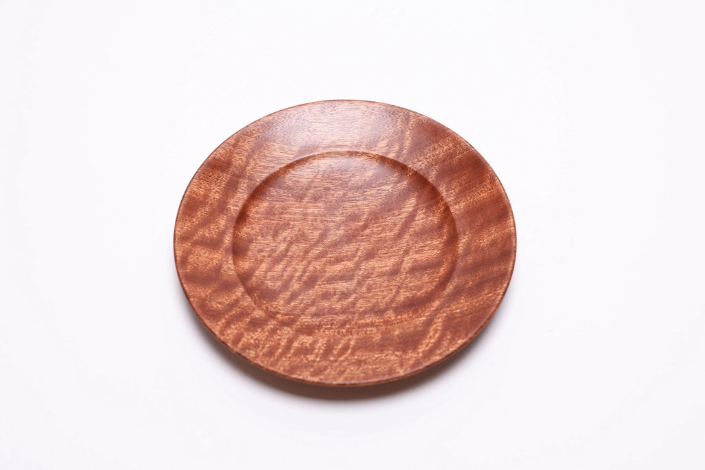 Quilted ribbon sapele wooden ring dish, top view rotated 30°, showing quilt figure grain pattern