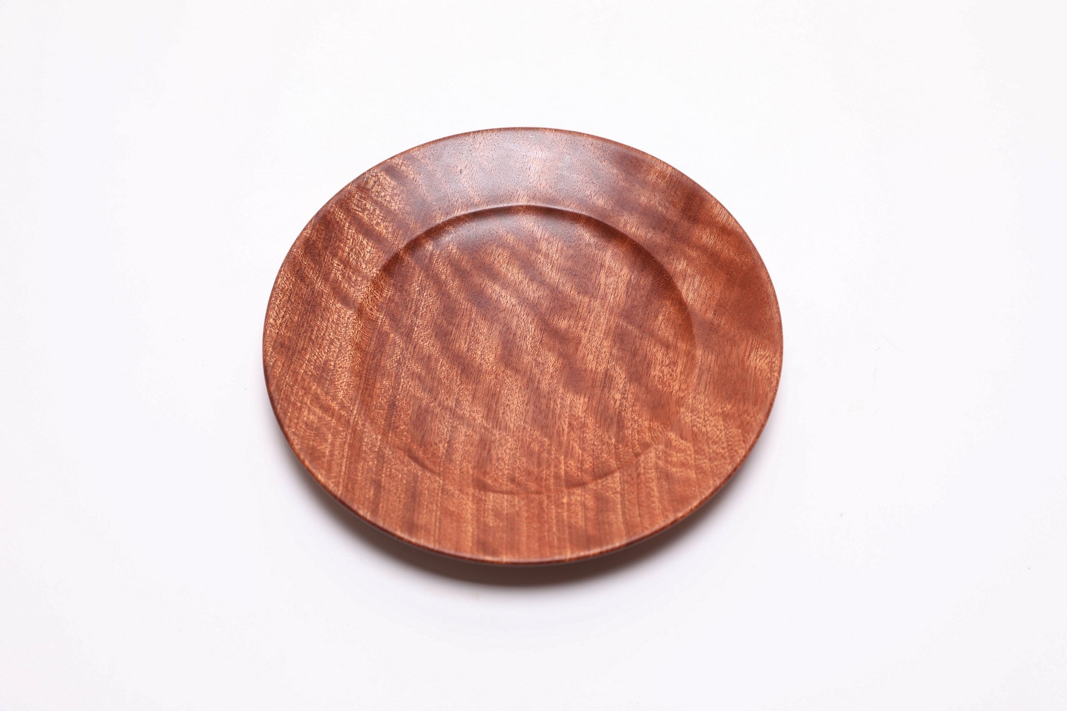 Small sapele ring dish, top view rotated 30°, natural oil finish with quilted figure detail