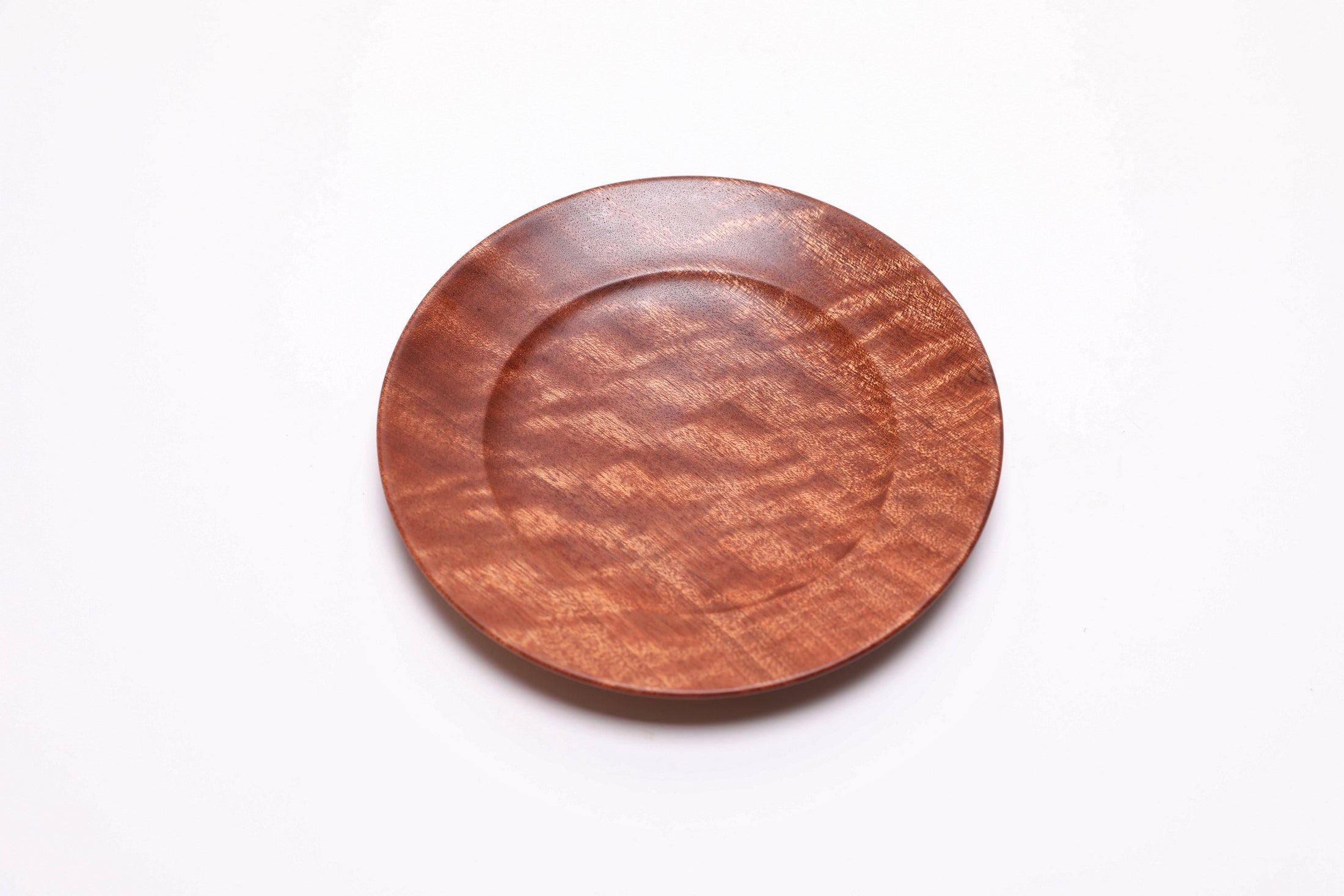 Handmade sapele ring dish, top view rotated 30°, food-safe oil finish and natural edge detail