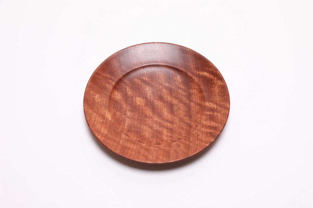 Wooden ring dish top view rotated 30°, quilted ribbon sapele, handcrafted in USA