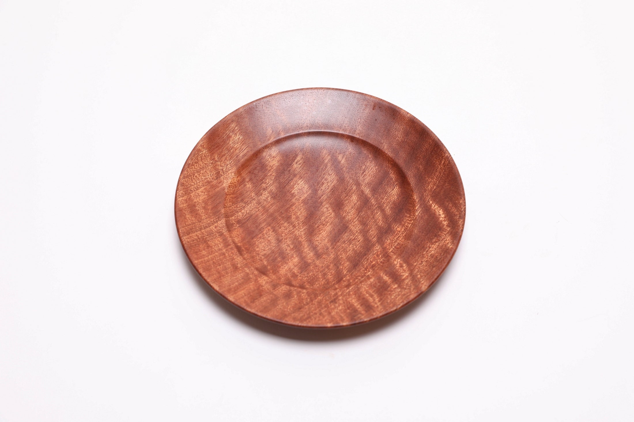 Quilted sapele ring dish, top view rotated 30°, 5½" shallow dish with raised foot