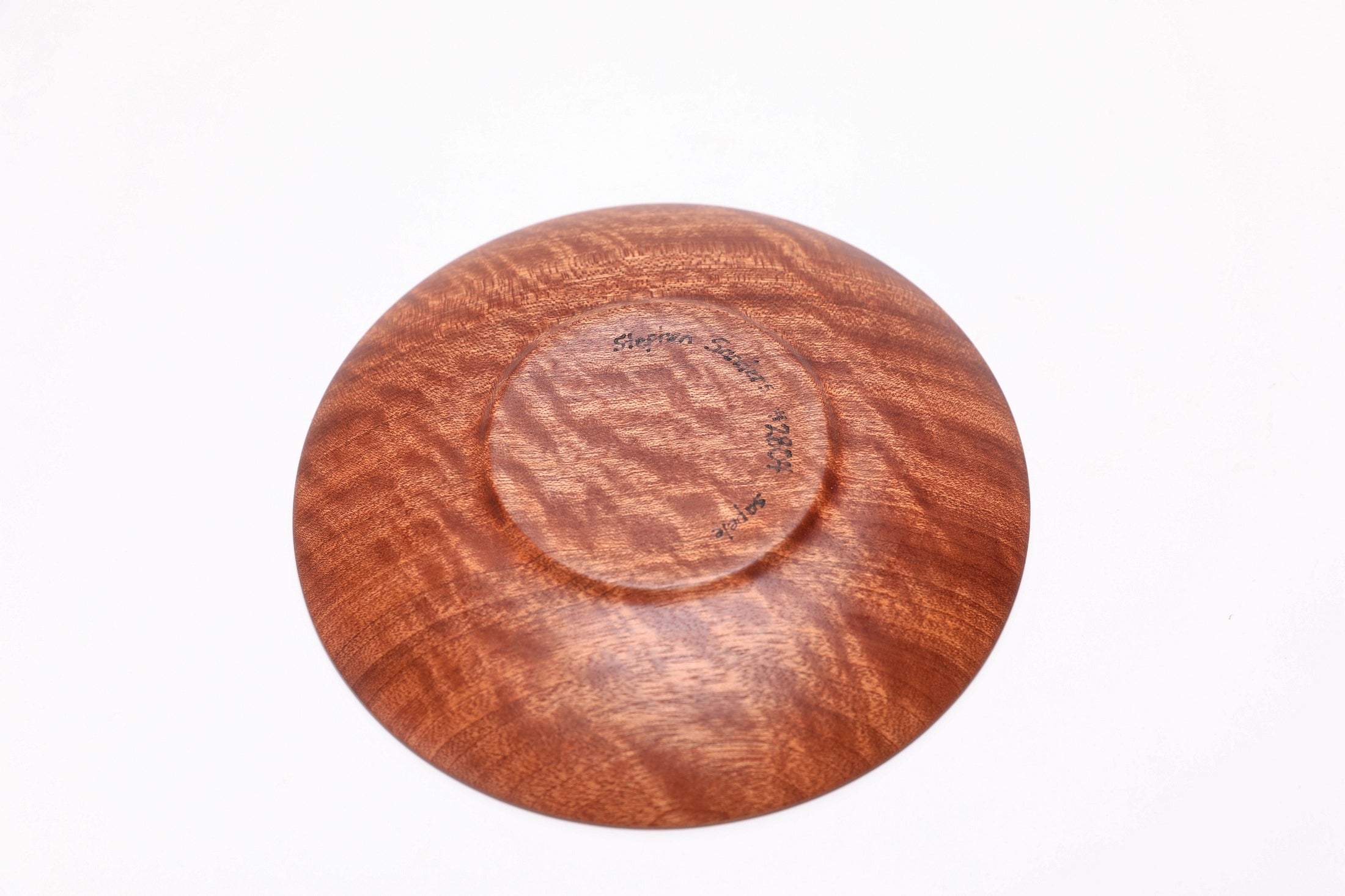 Bottom view of sapele wooden ring dish showing raised foot and natural wood grain, made in NC