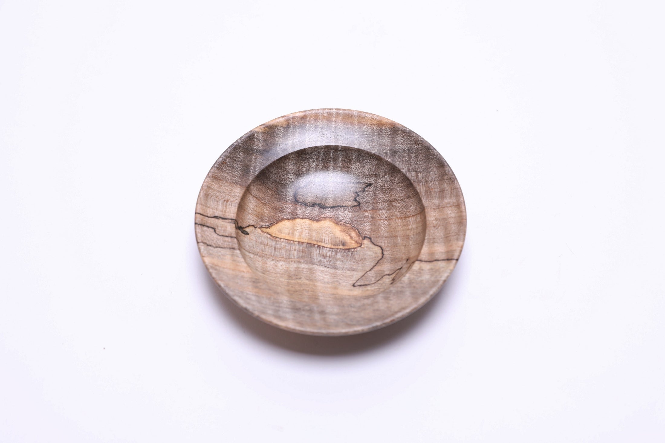Spalted tiger maple wooden ring dish, top view, showing gray-to-amber spalting and transition lines