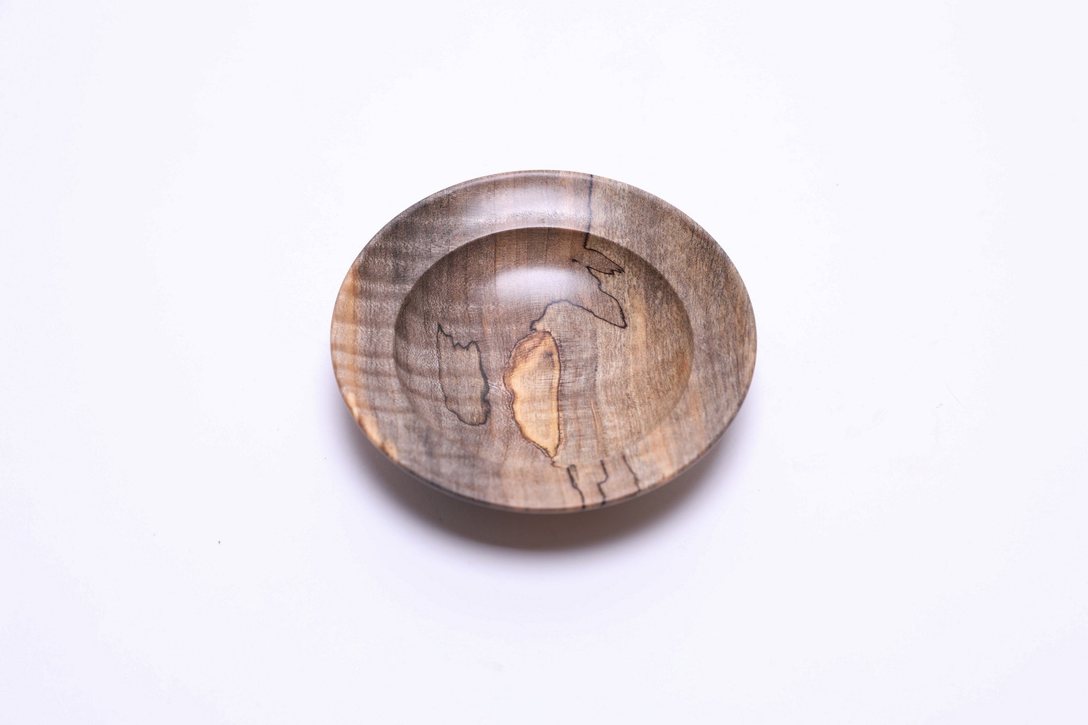 Spalted tiger maple ring dish, top view rotated 315°, gray-to-tan transition lines and tiger figure
