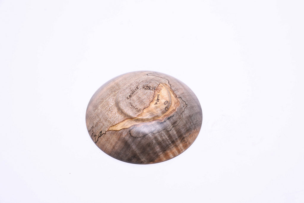 Bottom view of spalted tiger maple ring dish showing raised foot and natural wood grain

