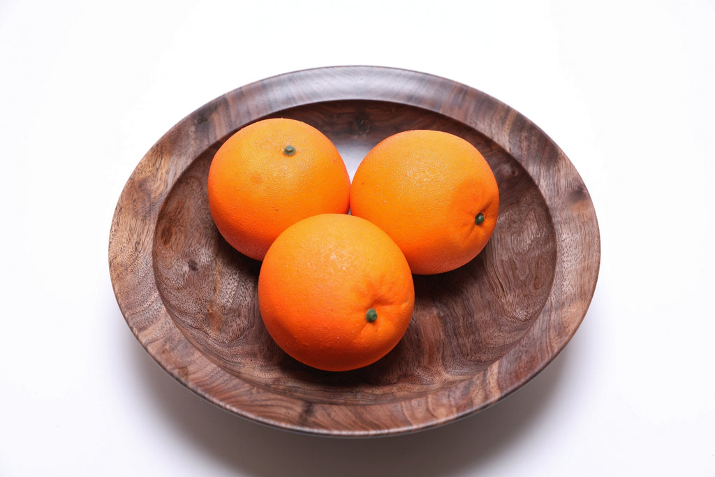 urly wild black walnut wooden bowl top view with three oranges for scale — 10-inch diameter bowl with rich curly figure, handcrafted fruit bowl or serving bowl made in NC
