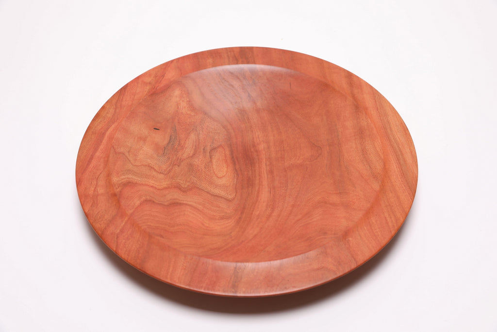 Wild black cherry wooden platter — top view, 90°, highlighting rich warm grain and filled worm hole