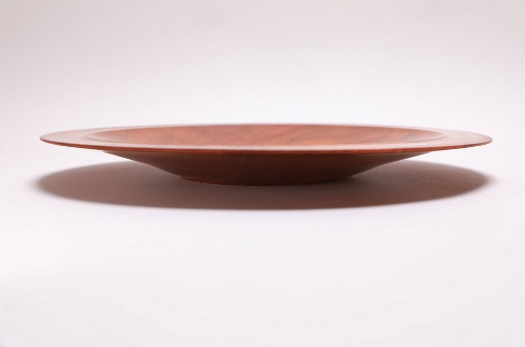  Wild black cherry wooden platter — side view, showing curved taper, raised foot, and 1.5" depth