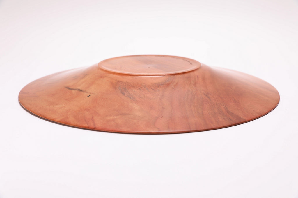 Wild black cherry wooden platter — bottom view showing raised foot and handcrafted construction