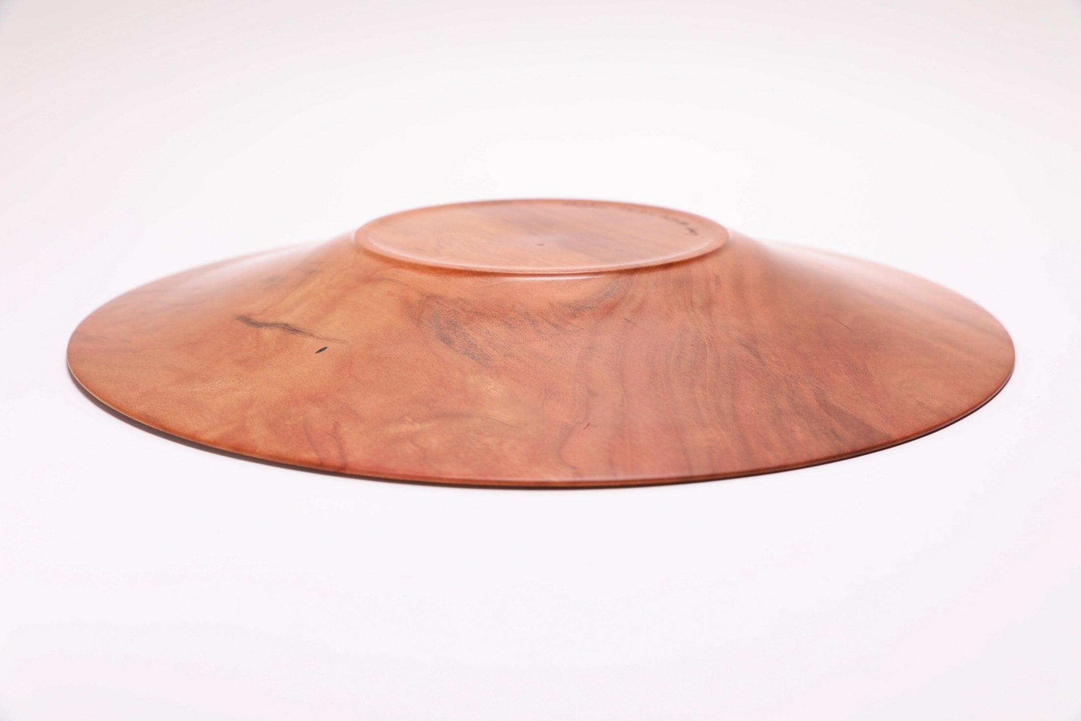 Wild black cherry wooden platter — bottom view showing raised foot and handcrafted construction