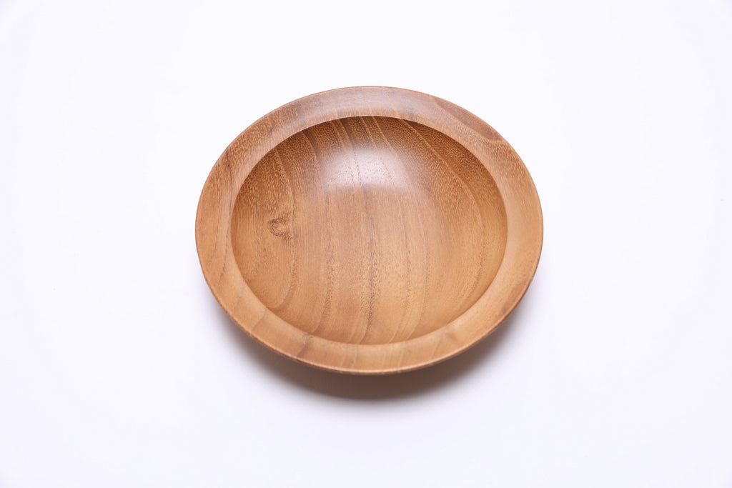 Small black locust wooden bowl top view rotated 90 degrees showing iridescent wood grain