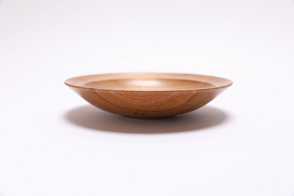 Small black locust wooden bowl side view showing 1-1/4 inch depth, handmade in NC