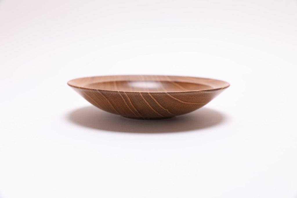 Small black locust wooden bowl side view rotated 90 degrees showing curved rim profile