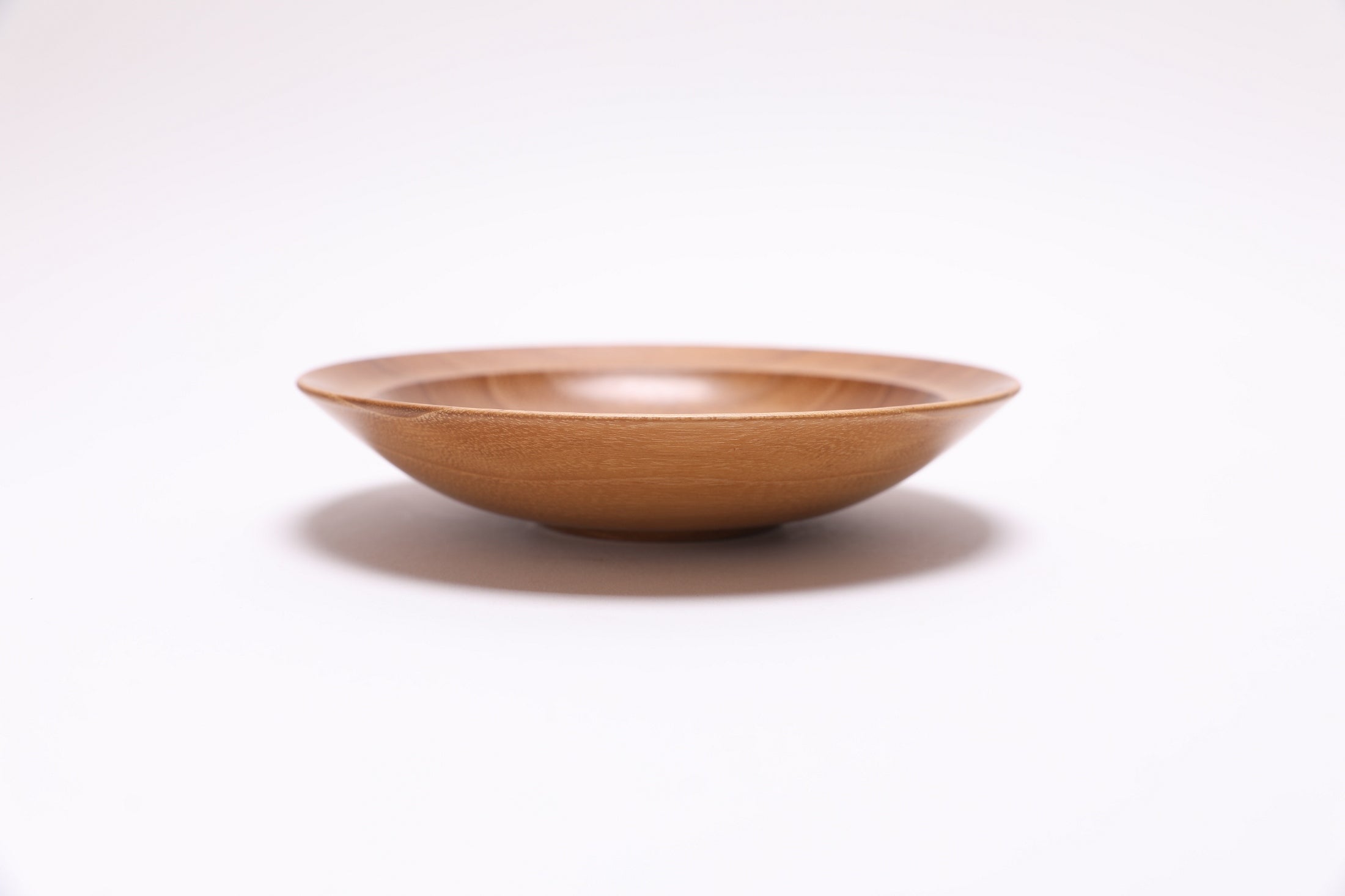 Small black locust wooden bowl side view rotated 180 degrees
