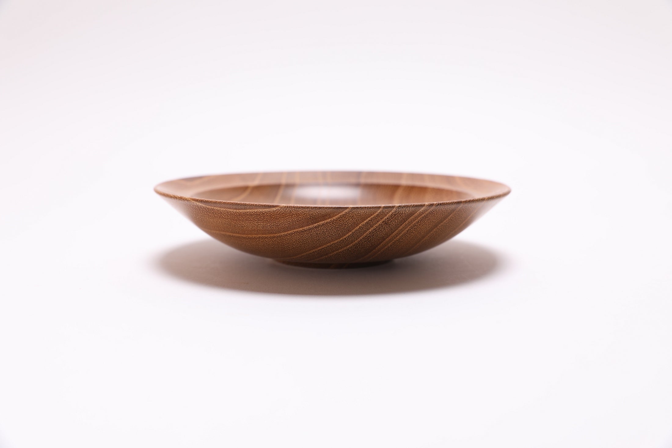 Small black locust wooden bowl side view rotated 270 degrees showing iridescent wood