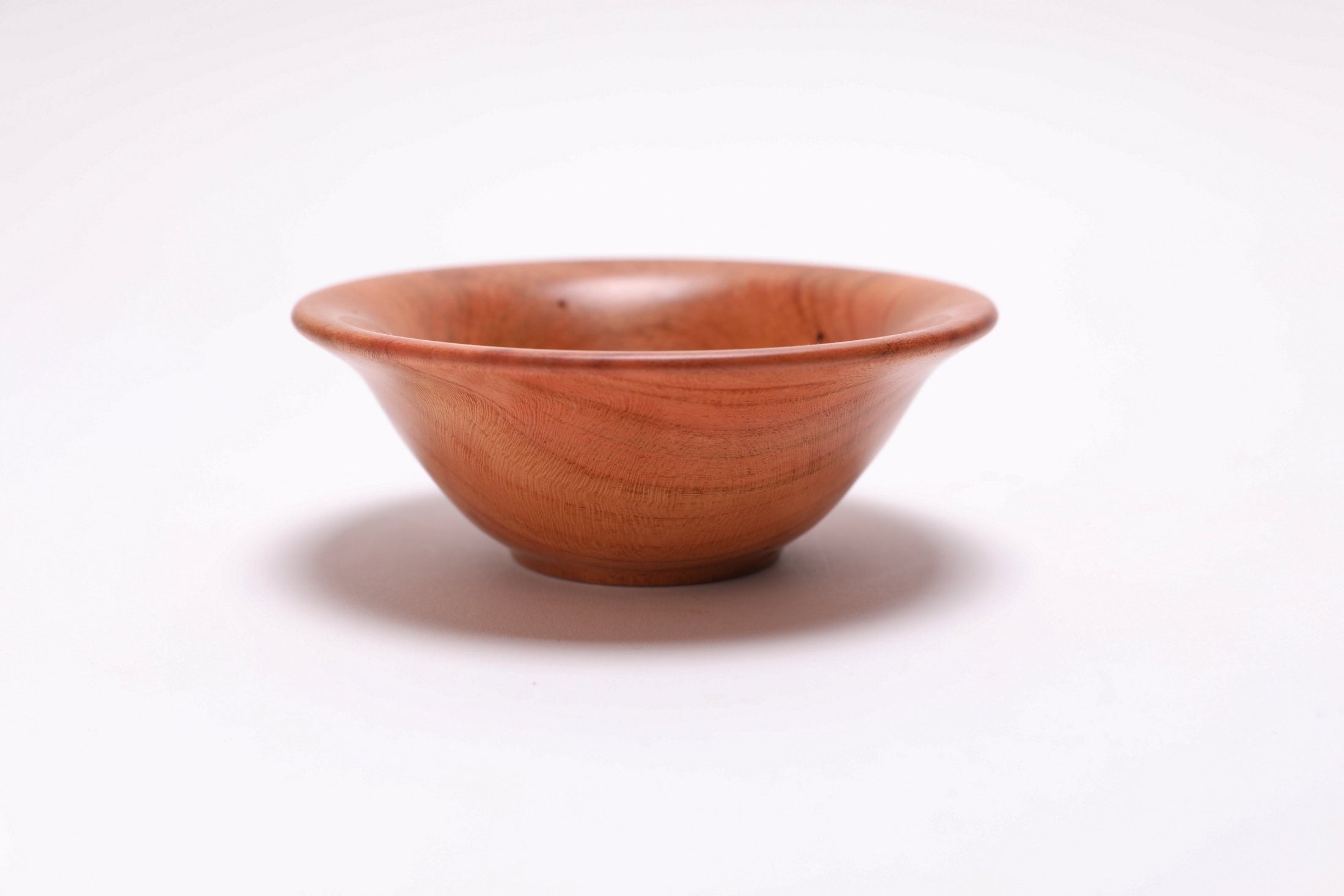 Small wild black cherry wooden bowl side view rotated 180 degrees showing natural wormholes