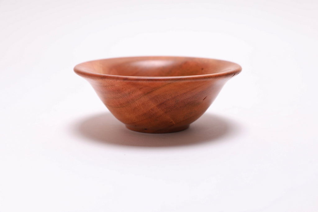 Small wild black cherry wooden bowl side view rotated 270 degrees showing raised foot and rich cherry color
